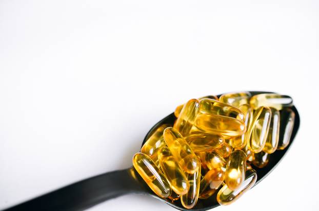 Fish oil, omega 3 capsules on a light background. Health