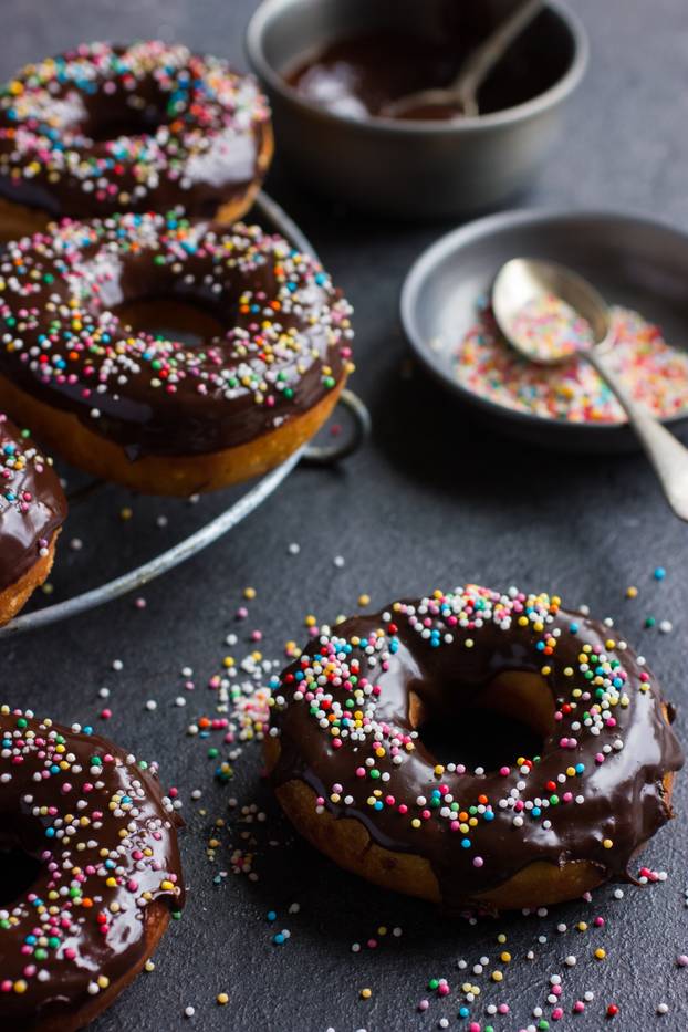 fresh chocolate donuts with chocolate glaze  and colorful sprink