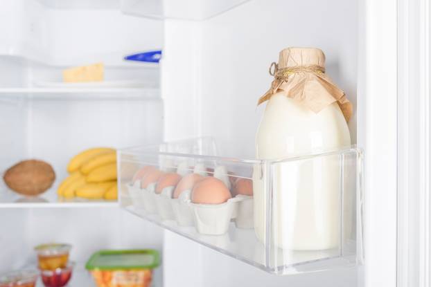 Open fridge full of fresh fruits and vegetables