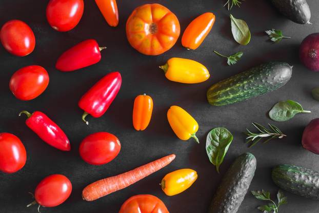 Fresh organic vegetables on a dark background. Top view