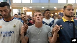 Faithful pray for Pope Francis' health during a Mass in Buenos Aires, Argentina, Feb. 18, 2025.