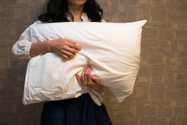 Woman holding a pillow